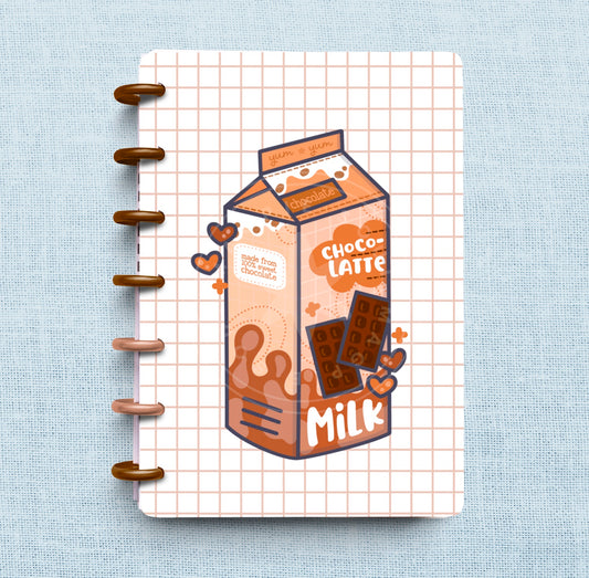 Kawaii chocolate milk drawing on white background with pale brown grid behind drawing all on laminated planner cover 