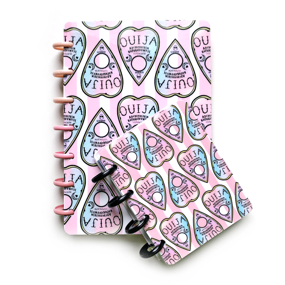 Pink and blue ombré pastel Ouija planchettes on pink striped backdrop for laminated discbound planner covers