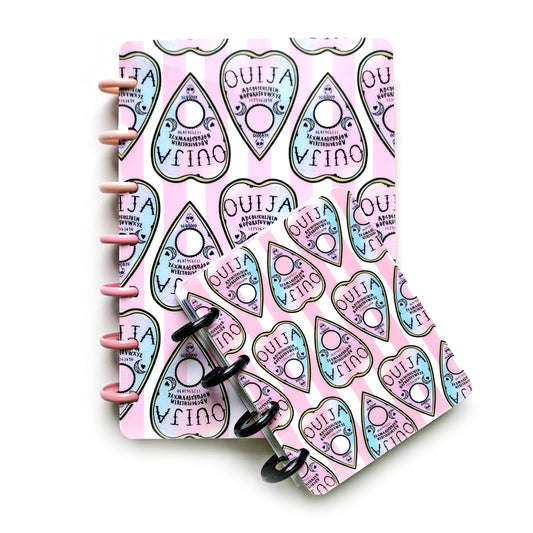 Pink and blue ombré pastel Ouija planchettes on pink striped backdrop for laminated discbound planner covers