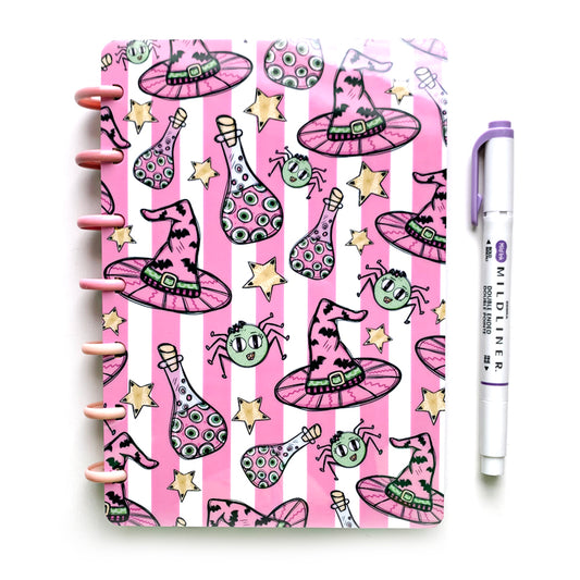 Pink striped halloween witch planner cover with eyeball potions and cute little green spiders by magpiesoul