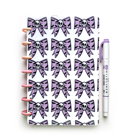 Pastel bat skull bows tiled on white background laminated planner cover magpiesoul