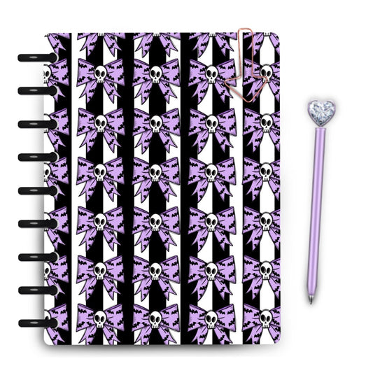 Pastel purple skull bow with mini bats tiled on black and white striped planner cover by magpiesoul