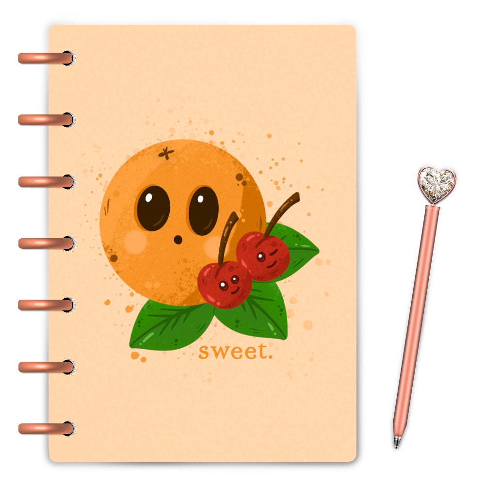 Kawaii orange and two happy cherries on an orange discbound planner cover